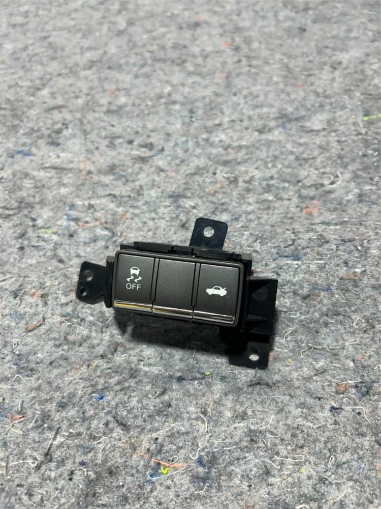 2014-2022 Infiniti Q50 OEM Left Front Lower Dash Traction Control Trunk Switch – photo 1